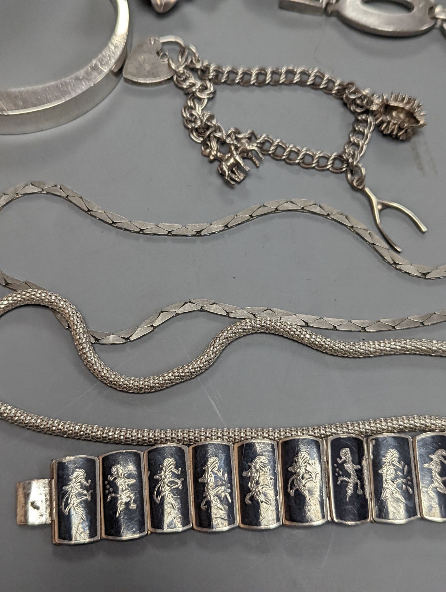 A quantity of assorted jewellery etc. including Danish sterling bangle and leaf brooch, a white meta and niello bracelet and a 925 and enamel flower brooch.